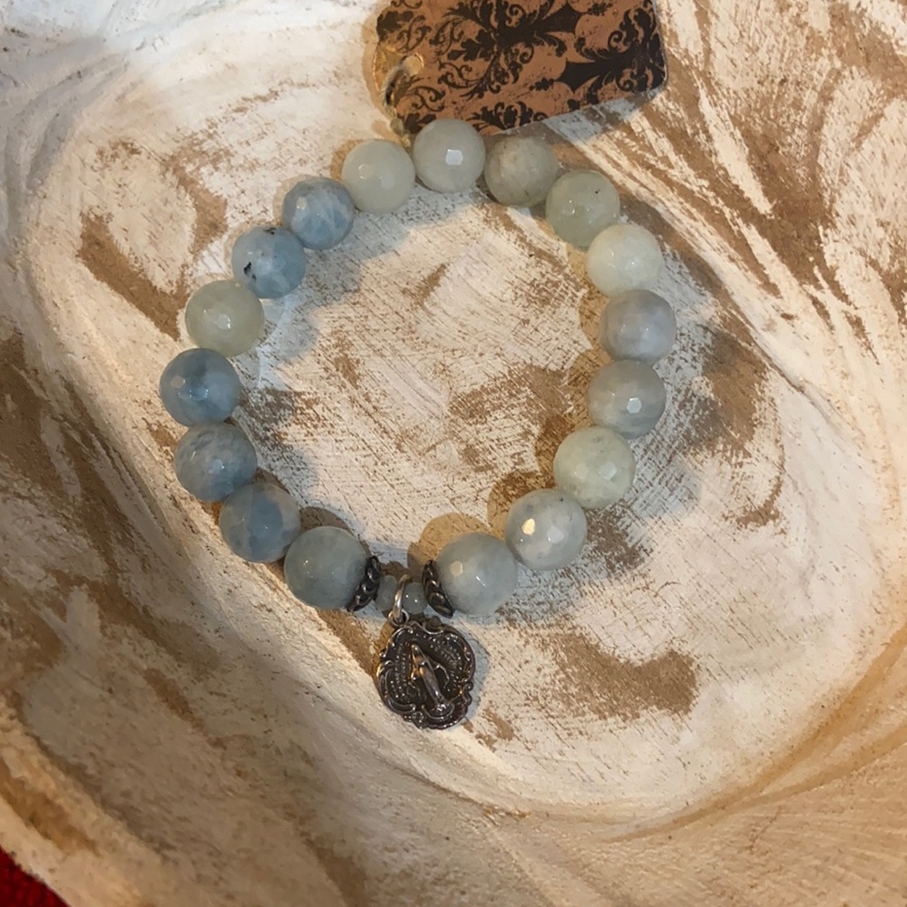 Light blue stones with Virgin Mary medal